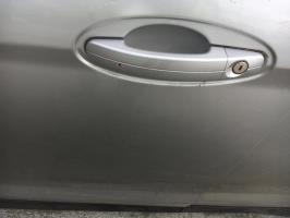 Poignee porte avant gauche