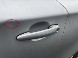 Poignee porte avant gauche