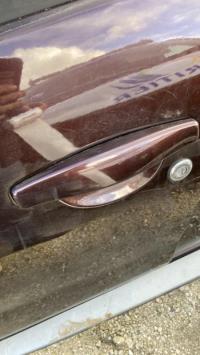 Poignee porte avant gauche