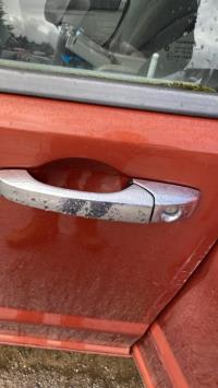 Poignee porte avant gauche